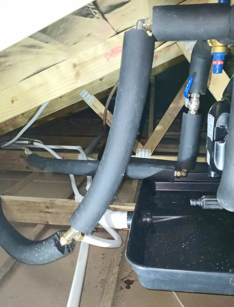 A geyser in the roof: drip tray, valves and insulated pipes