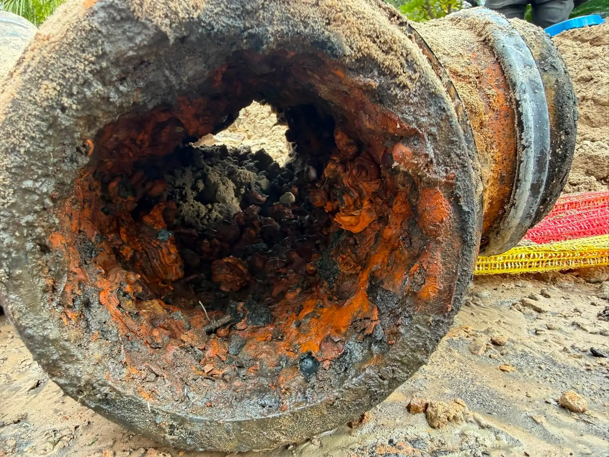 A corroded pipe dug up on a job in July 2026