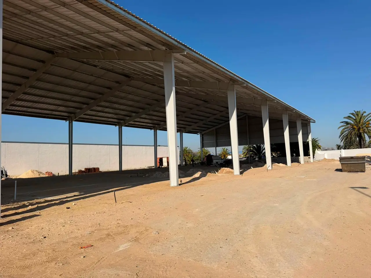 A large covered structure on a construction site